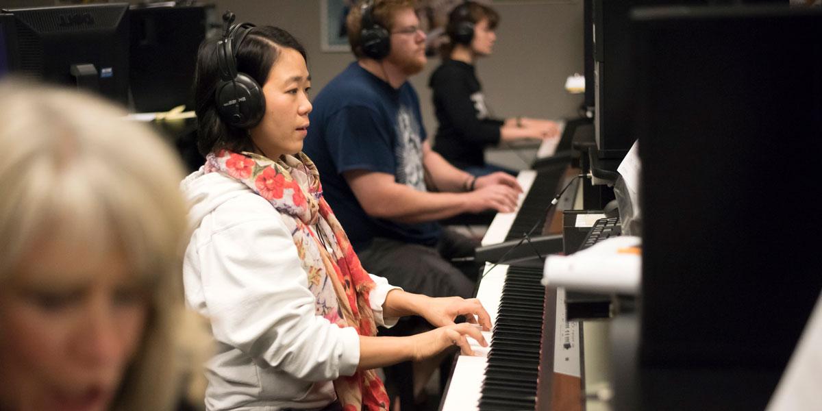 AACC student playing the piano.